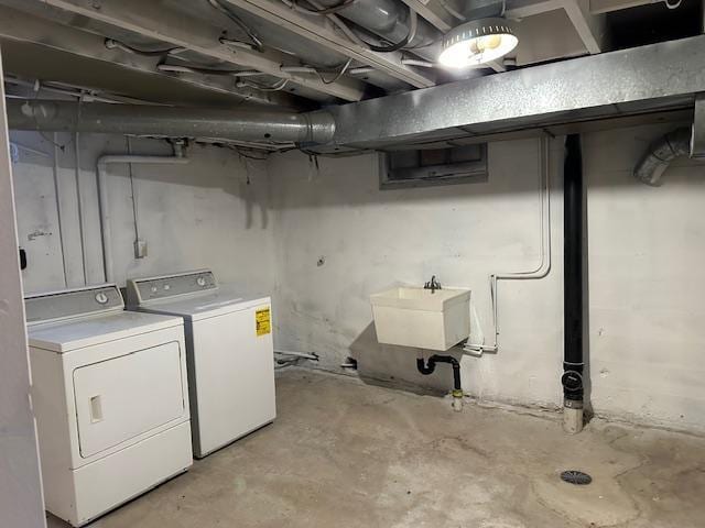 laundry area featuring sink and washing machine and dryer