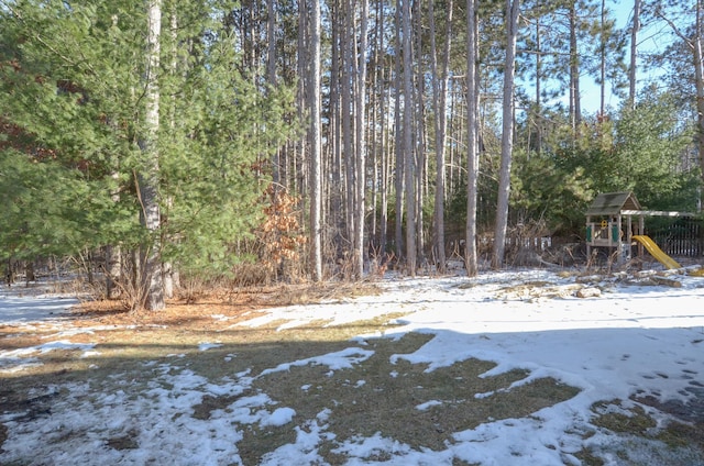 snowy yard with a playground