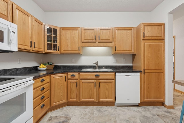 kitchen with sink and white appliances