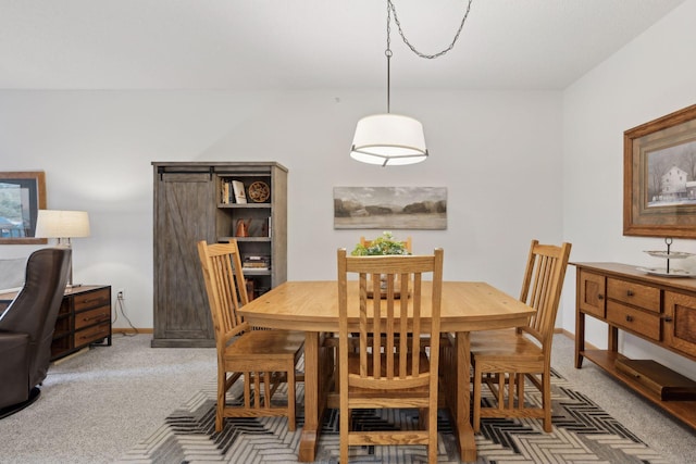 view of carpeted dining area