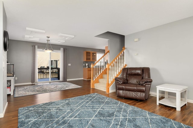 living room with dark hardwood / wood-style flooring