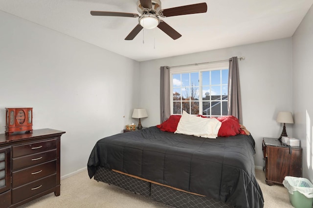 bedroom featuring ceiling fan and light colored carpet