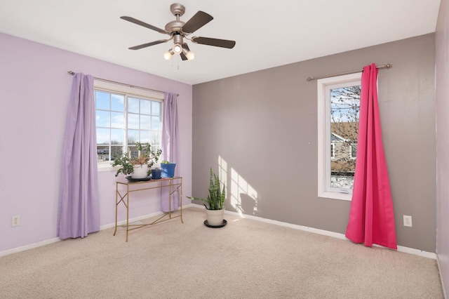 misc room with ceiling fan and light colored carpet