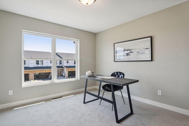 home office with light colored carpet