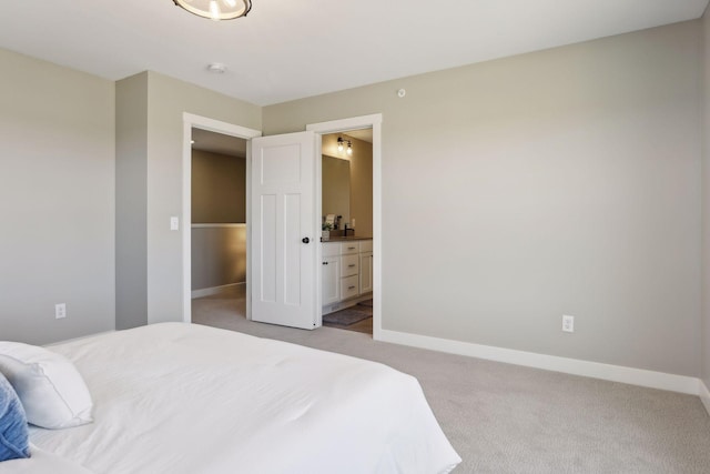 carpeted bedroom with ensuite bathroom