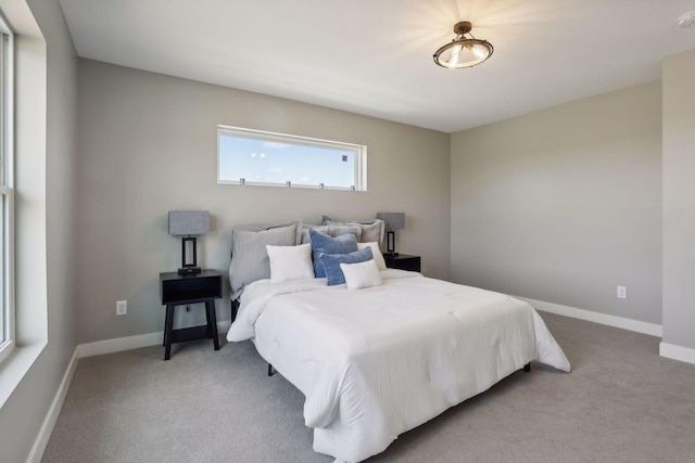 bedroom featuring light carpet