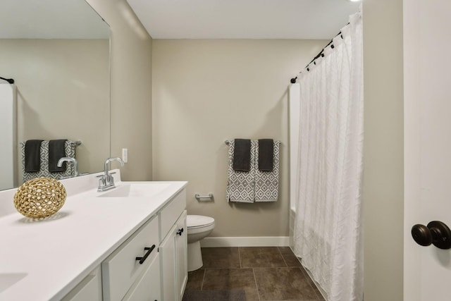 bathroom featuring vanity, toilet, and a shower with shower curtain