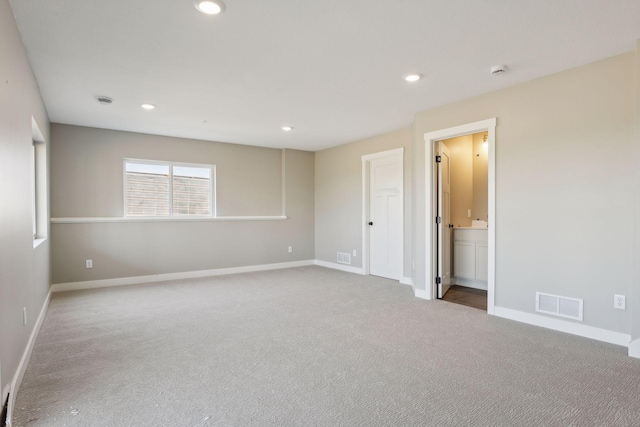 spare room featuring carpet flooring