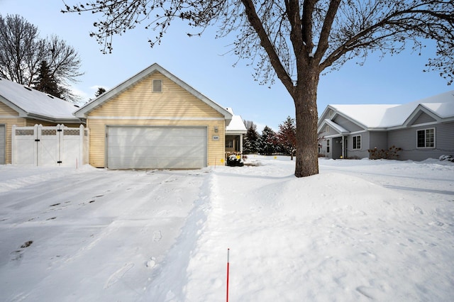 exterior space featuring fence and a garage