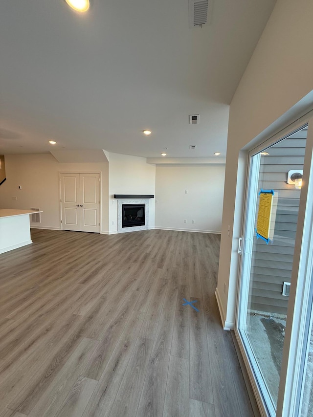 unfurnished living room with light wood-type flooring