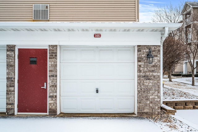 view of snow covered garage