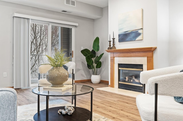 living room with a healthy amount of sunlight and hardwood / wood-style floors