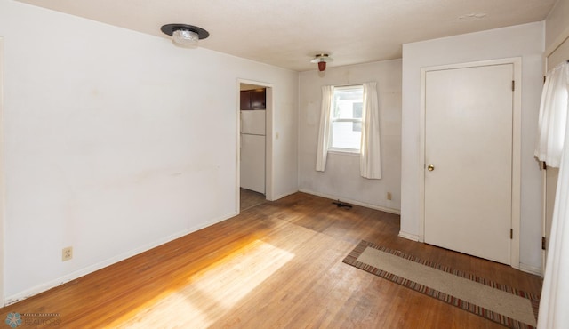 unfurnished bedroom with wood-type flooring