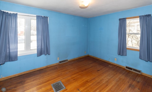 empty room with wood-type flooring