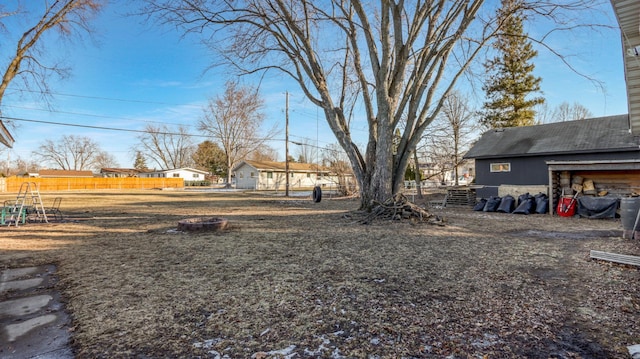 view of yard featuring an outdoor fire pit