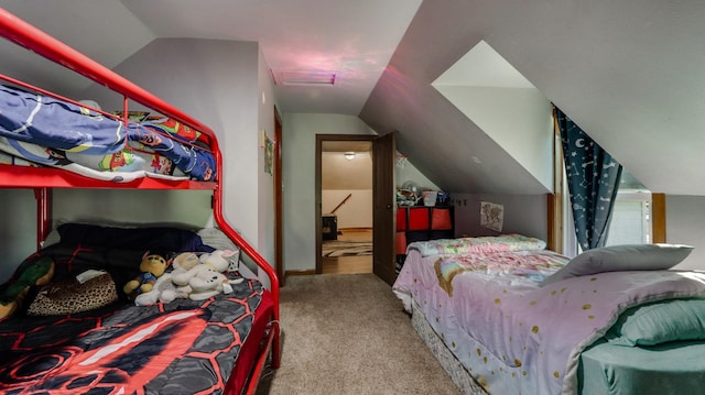 carpeted bedroom featuring lofted ceiling