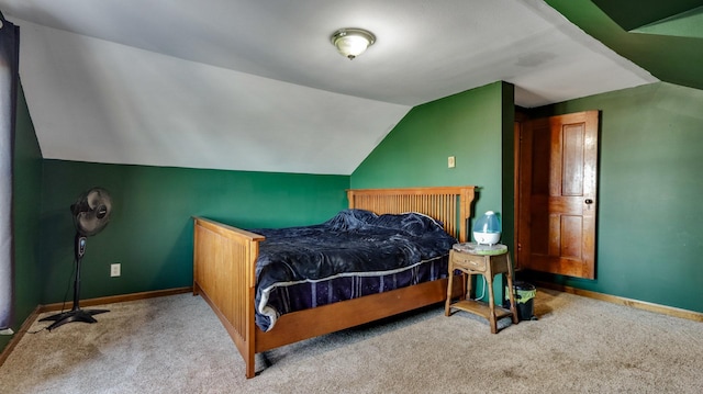 carpeted bedroom featuring vaulted ceiling