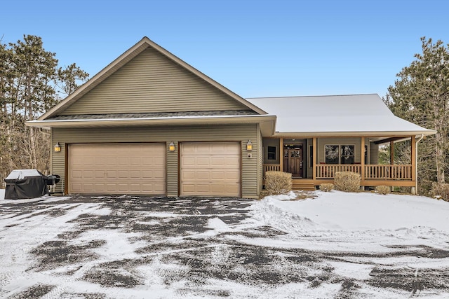 view of front facade with a porch and a garage