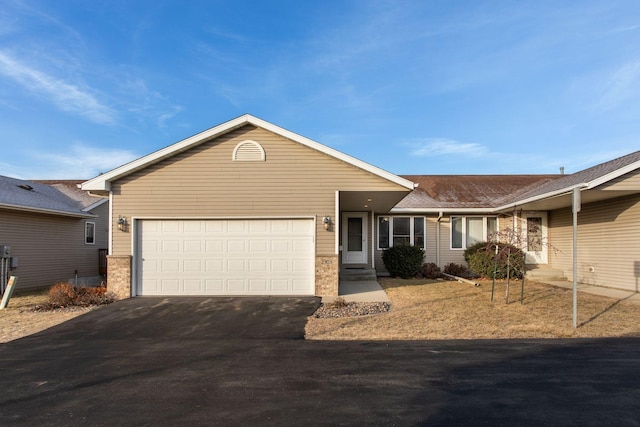 single story home featuring a garage