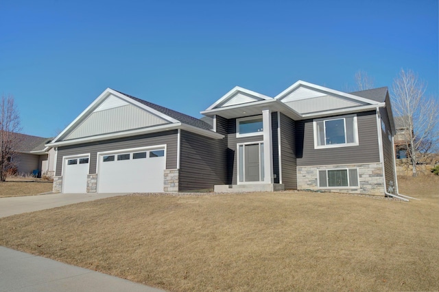 view of front of property with a garage and a front yard