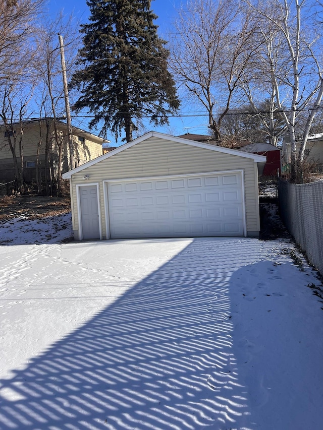 view of snow covered garage