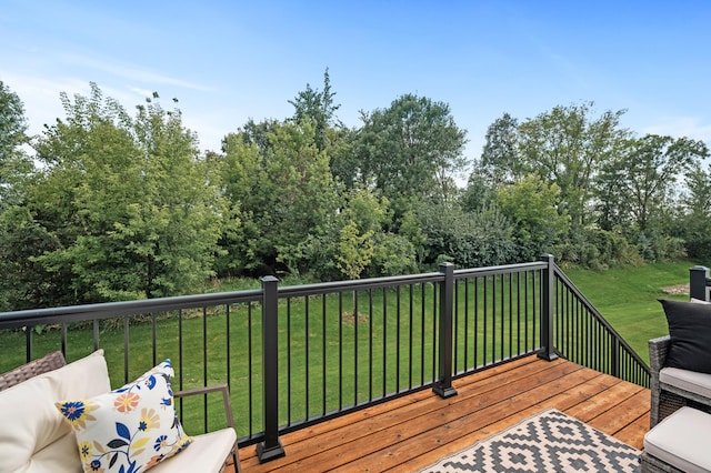 wooden deck featuring a yard