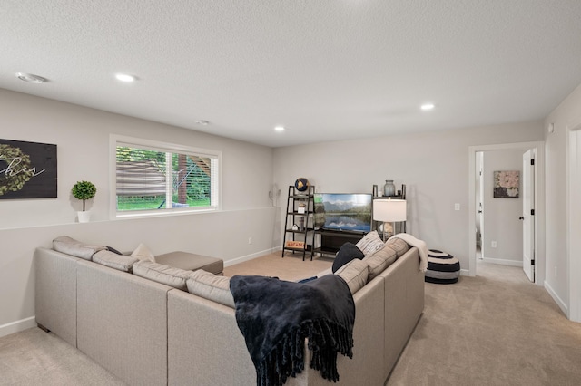 carpeted living room featuring a textured ceiling