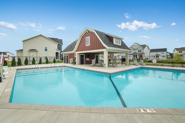 view of swimming pool featuring a patio area