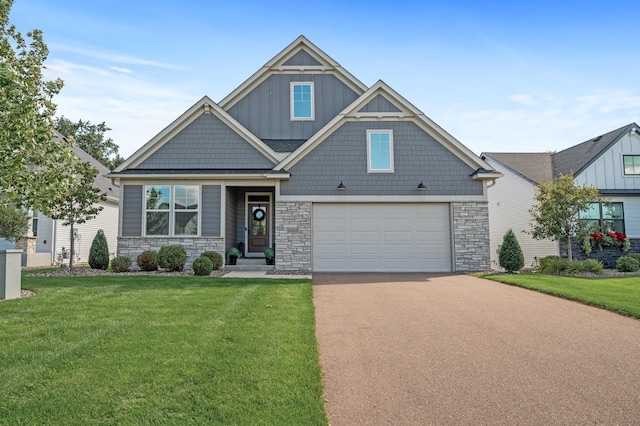 craftsman-style house featuring a garage and a front yard