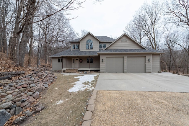 view of front of property featuring a garage and covered porch