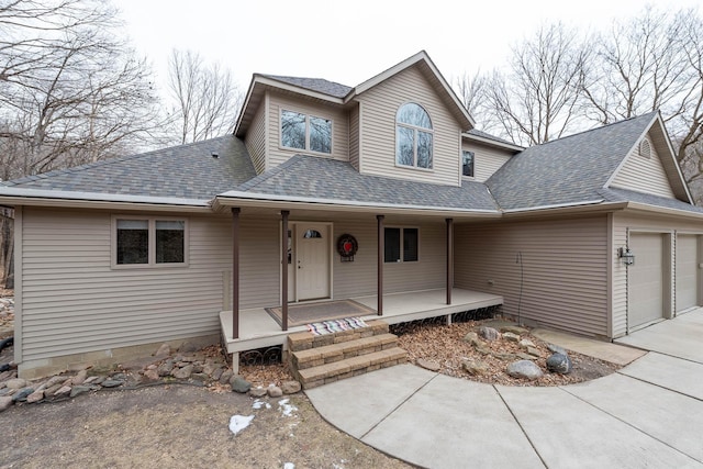 view of front of property with a garage and covered porch