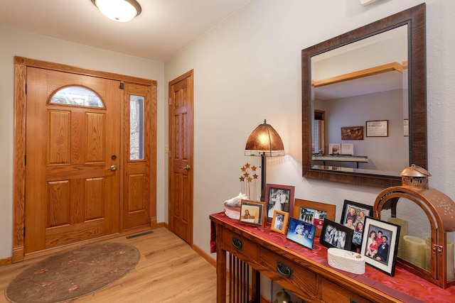 foyer with light wood-type flooring