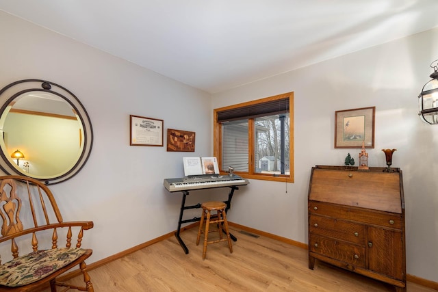 living area with light hardwood / wood-style floors