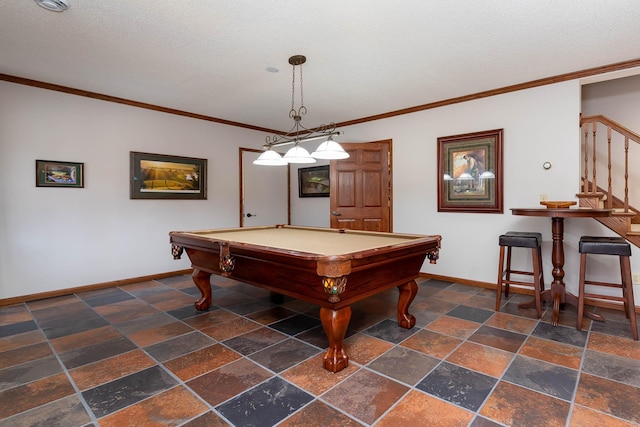 rec room with ornamental molding, a textured ceiling, and billiards