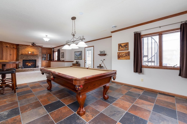 playroom with a fireplace, ornamental molding, pool table, ceiling fan, and a textured ceiling