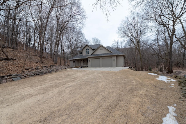 view of side of property featuring a garage