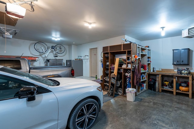 garage featuring a garage door opener and stainless steel fridge