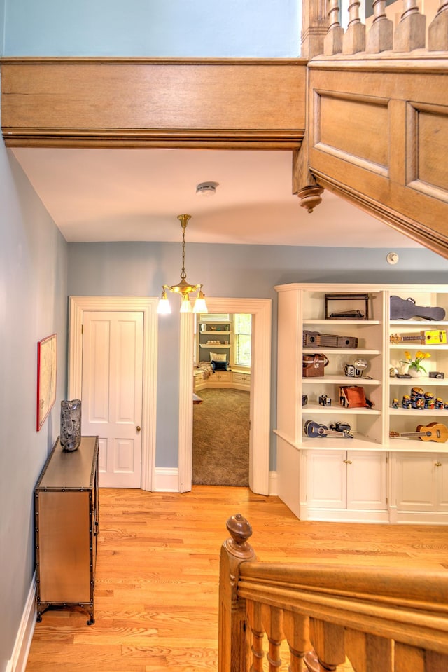 hall with light hardwood / wood-style floors