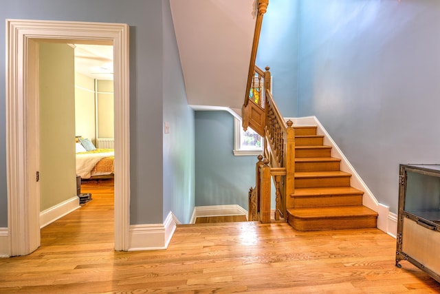 stairway featuring hardwood / wood-style flooring