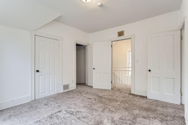 unfurnished bedroom with carpet flooring