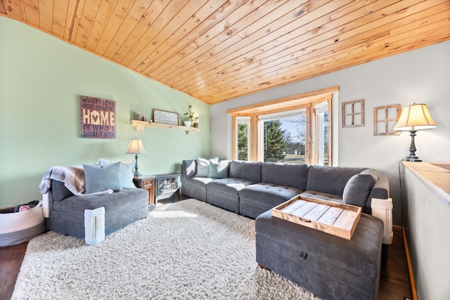 living area with vaulted ceiling, wood finished floors, and wooden ceiling