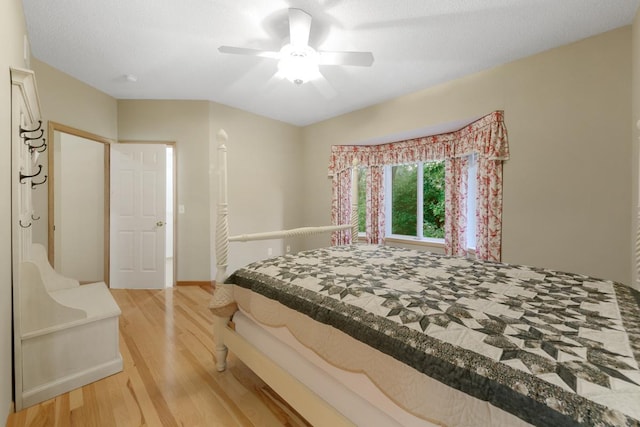 bedroom with hardwood / wood-style floors and ceiling fan