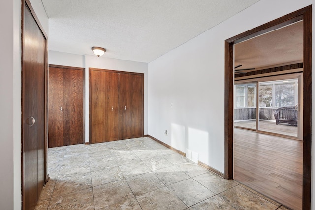 interior space with a textured ceiling