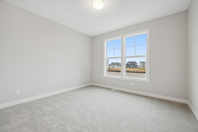 unfurnished room featuring carpet flooring