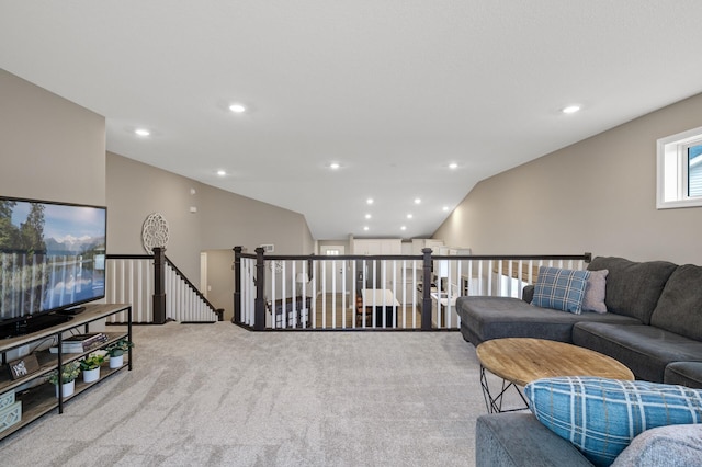 living room featuring vaulted ceiling, carpet, and recessed lighting