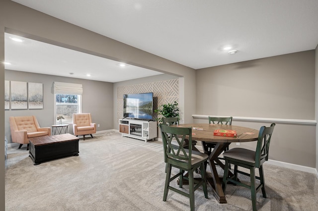 dining room featuring recessed lighting, baseboards, and light colored carpet