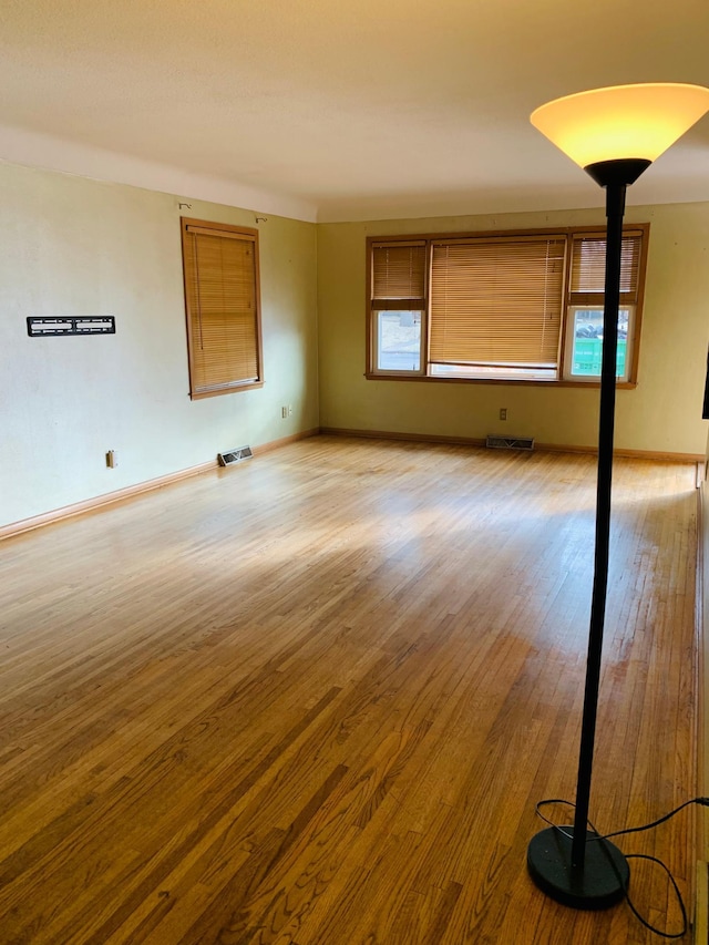 unfurnished living room featuring hardwood / wood-style floors