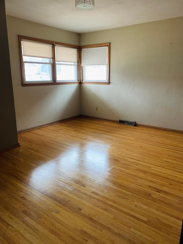 empty room with light hardwood / wood-style floors