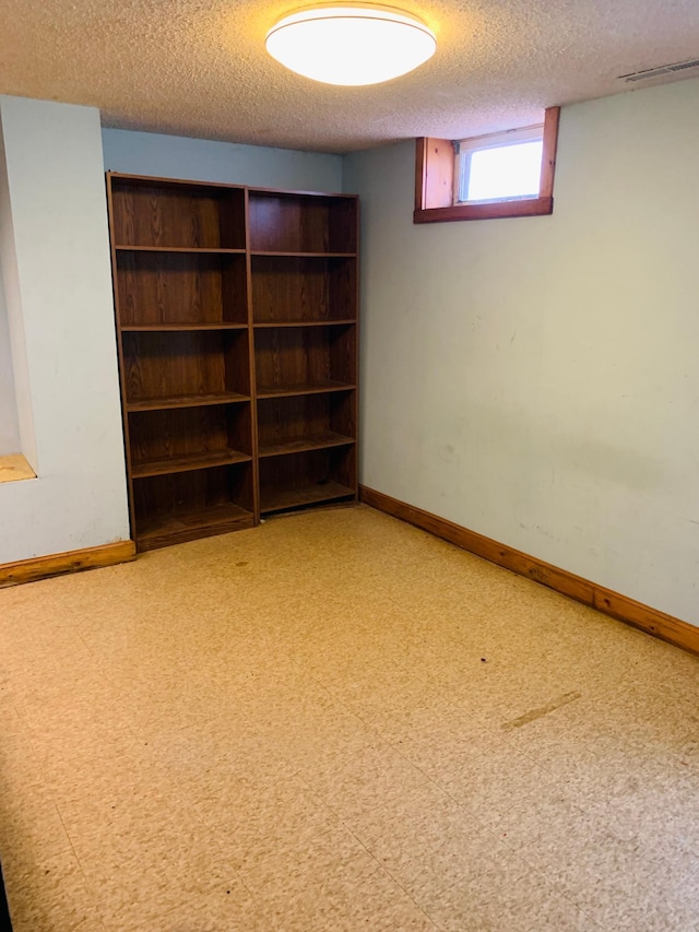 basement with a textured ceiling