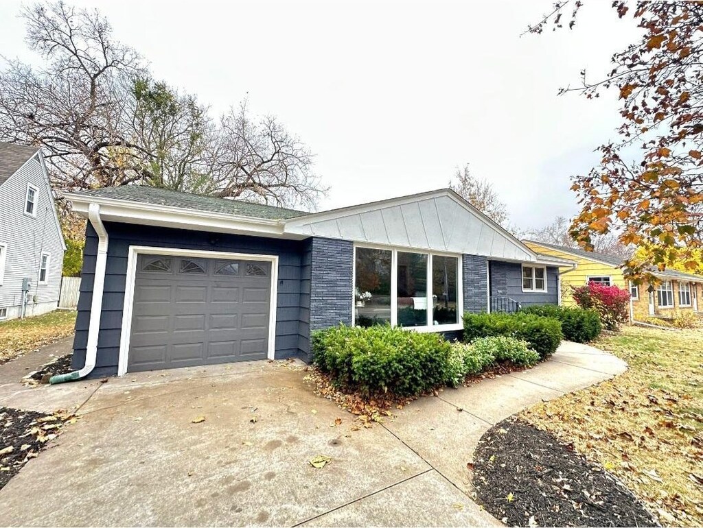 ranch-style house featuring a garage